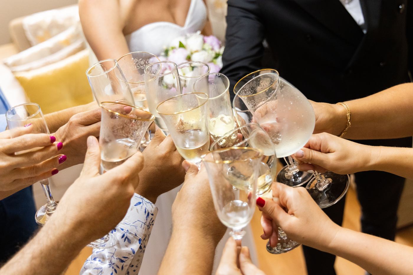 Guests clink champagne glasses in a toast